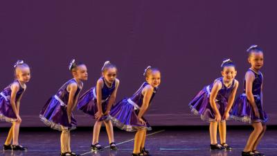Young Tap Dancers in Purple Dresses